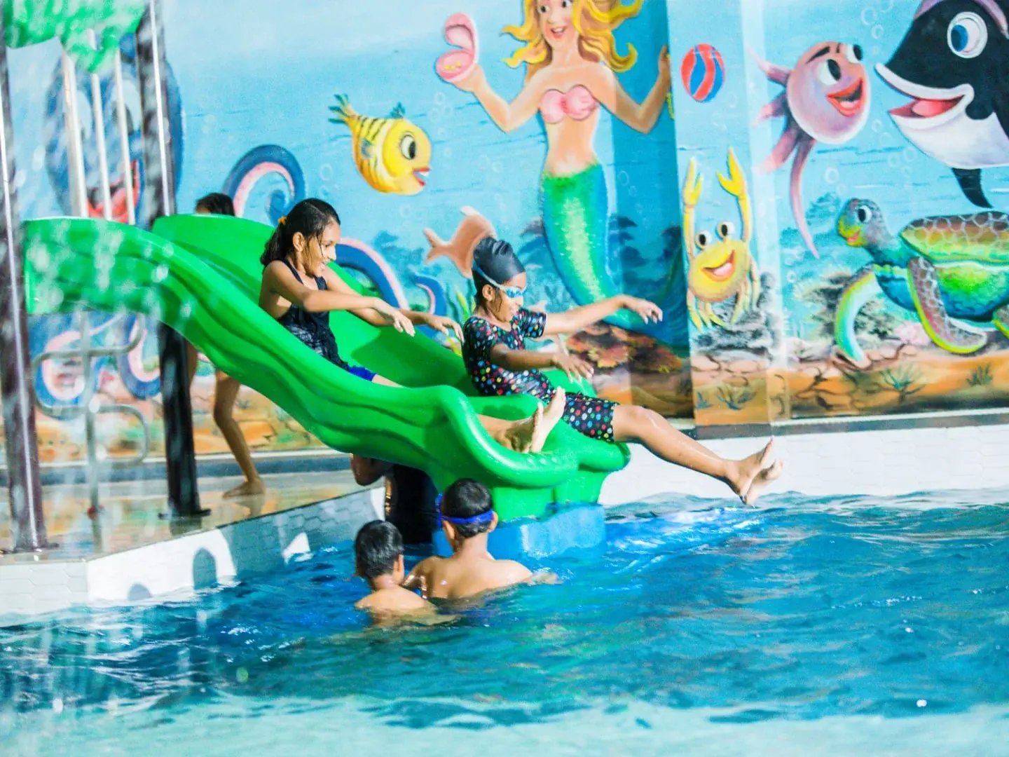 Kid sliding down a slide